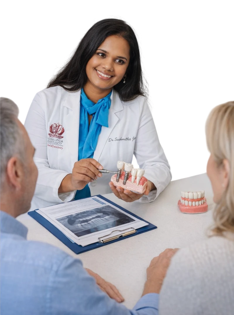 Dr. Jeeri explaining dental implants to patients at Gentle Smiles of Cherry Hill, NJ